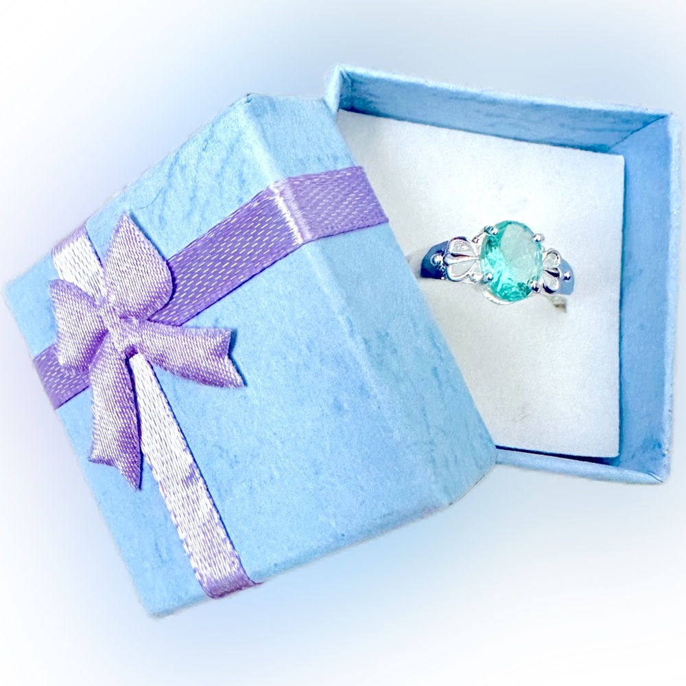 Silver ring with light blue stone estimated woman’s size 6/7